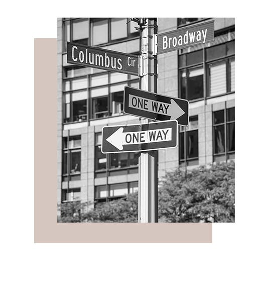 Street signs for Columbus Circle and Broadway in New York City.