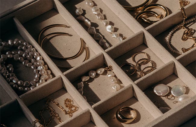 Jewelry organized in a box.