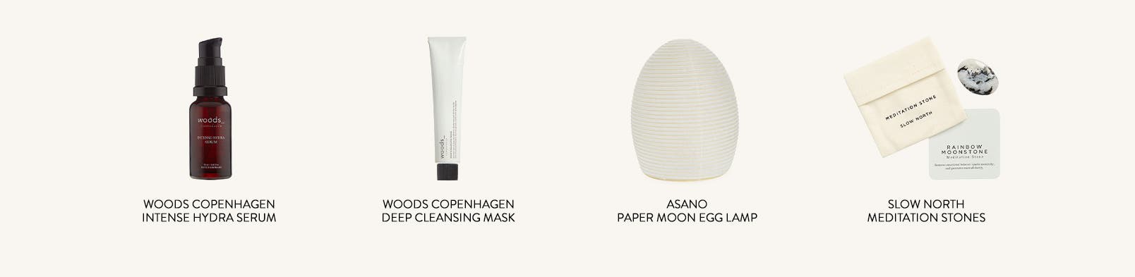 A serum, cleansing mask, egg-shaped lamp and meditation stones.