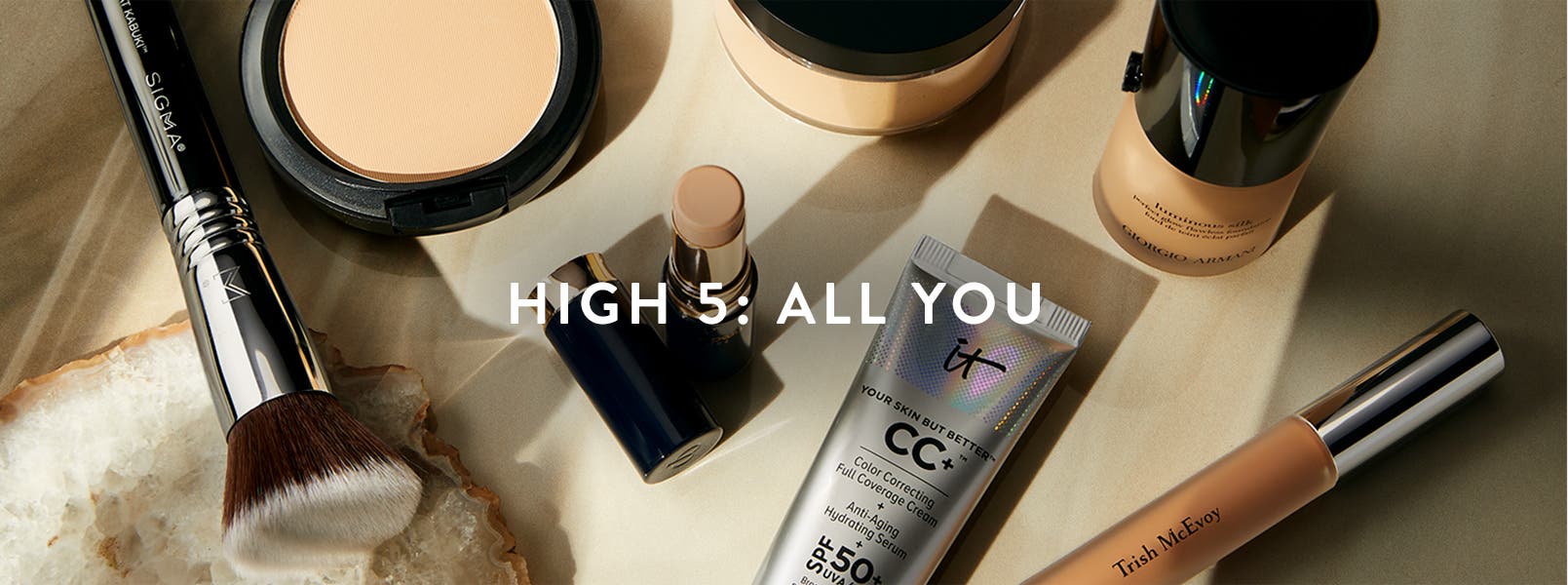 High 5: all you. An assortment of face makeup products sitting on a countertop.