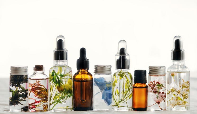 Different essential oils lined up on a table