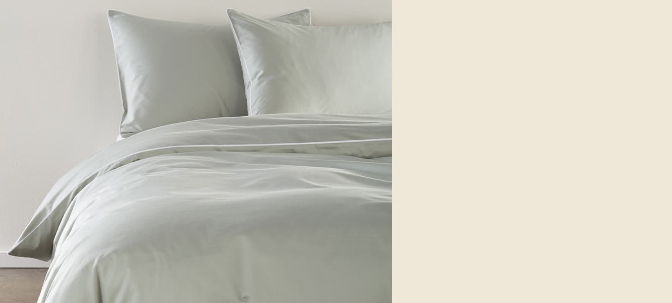 Grey sateen sheets, pillowcases and duvet.