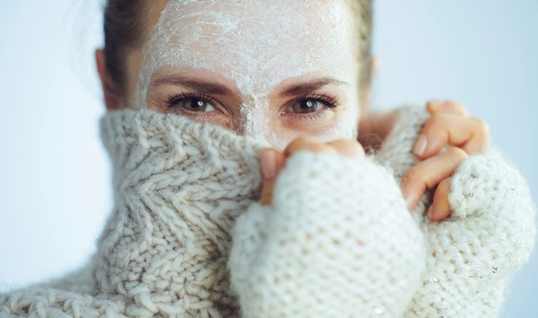 woman wearing a face mask in winter