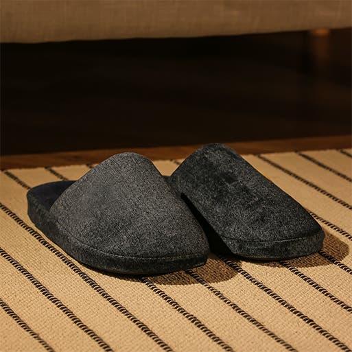 A pair of black slippers.