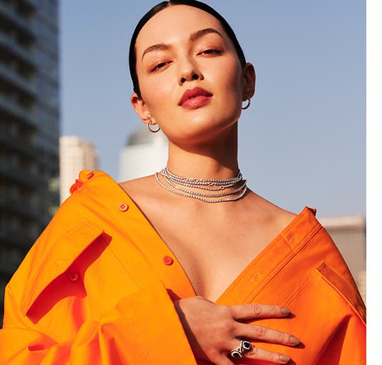 Woman wearing Bony Levy earrings, necklaces and ring.