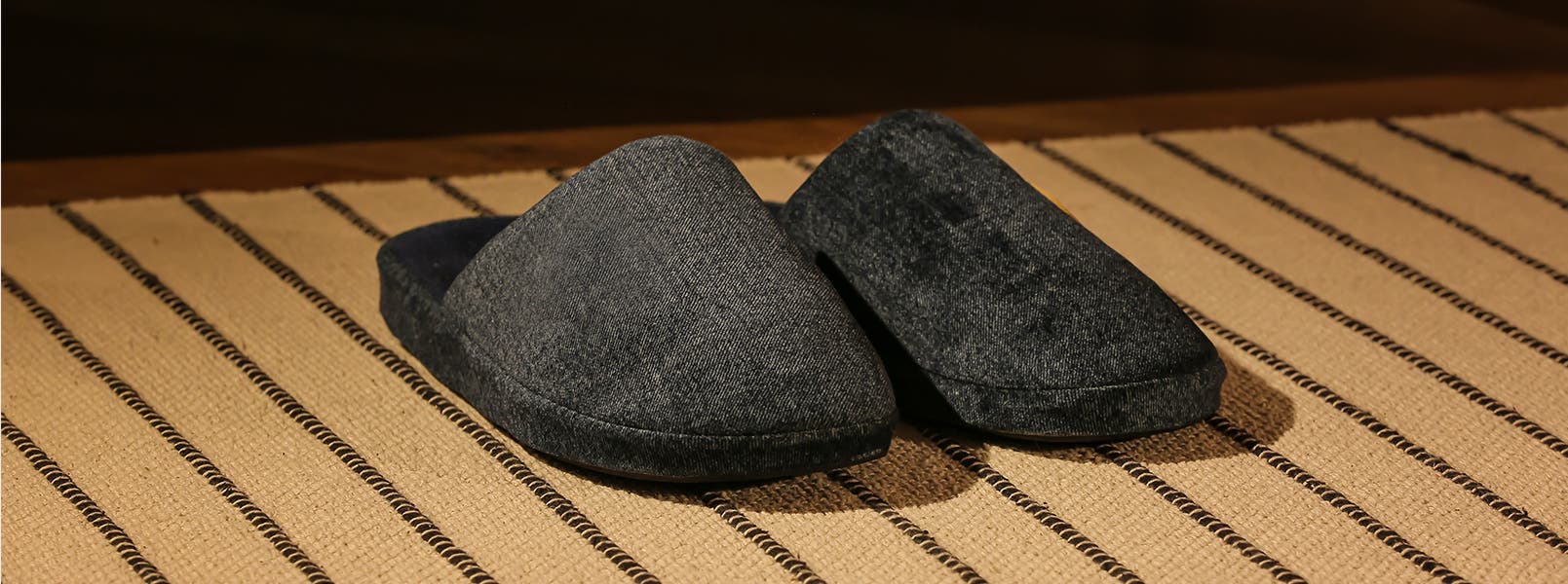 A pair of black slippers.
