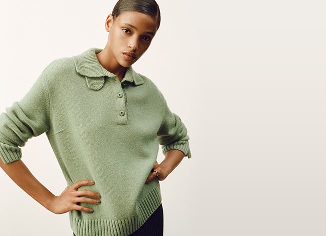 Model wearing a soft-green Loro Piana sweater.