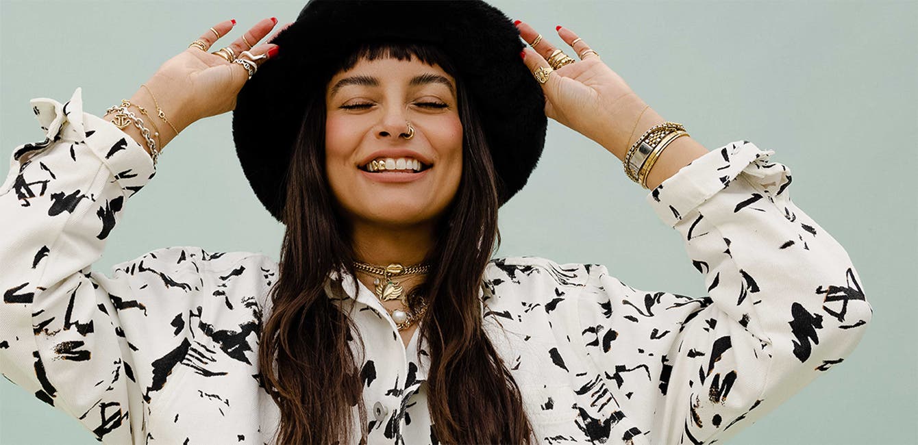 A model wears a Nordstrom by Cristina Martinez shirt.