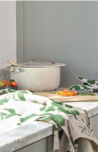 Neutral-colored cookware and kitchen essentials.