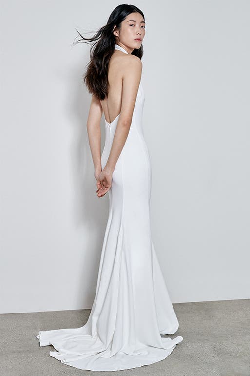 Bride in a backless wedding dress.