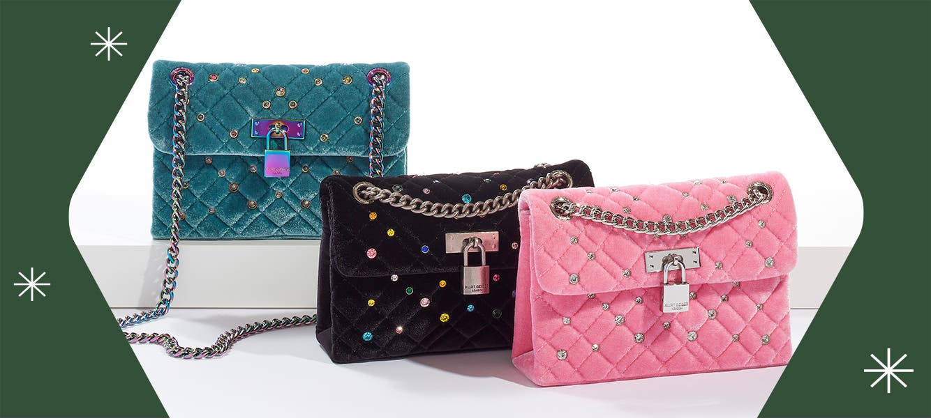 Three velvet, quilted and jeweled Kurt Geiger London handbags in teal, black and pink. Speech bubble reads show me off.