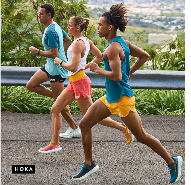 Two men and a woman running in HOKA ONE ONE active tops, shorts and shoes.