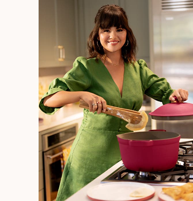 Selena Gomez frying an egg. Selena Gomez cooking with the Perfect Pot. Selena Gomez holding the Always Pan.