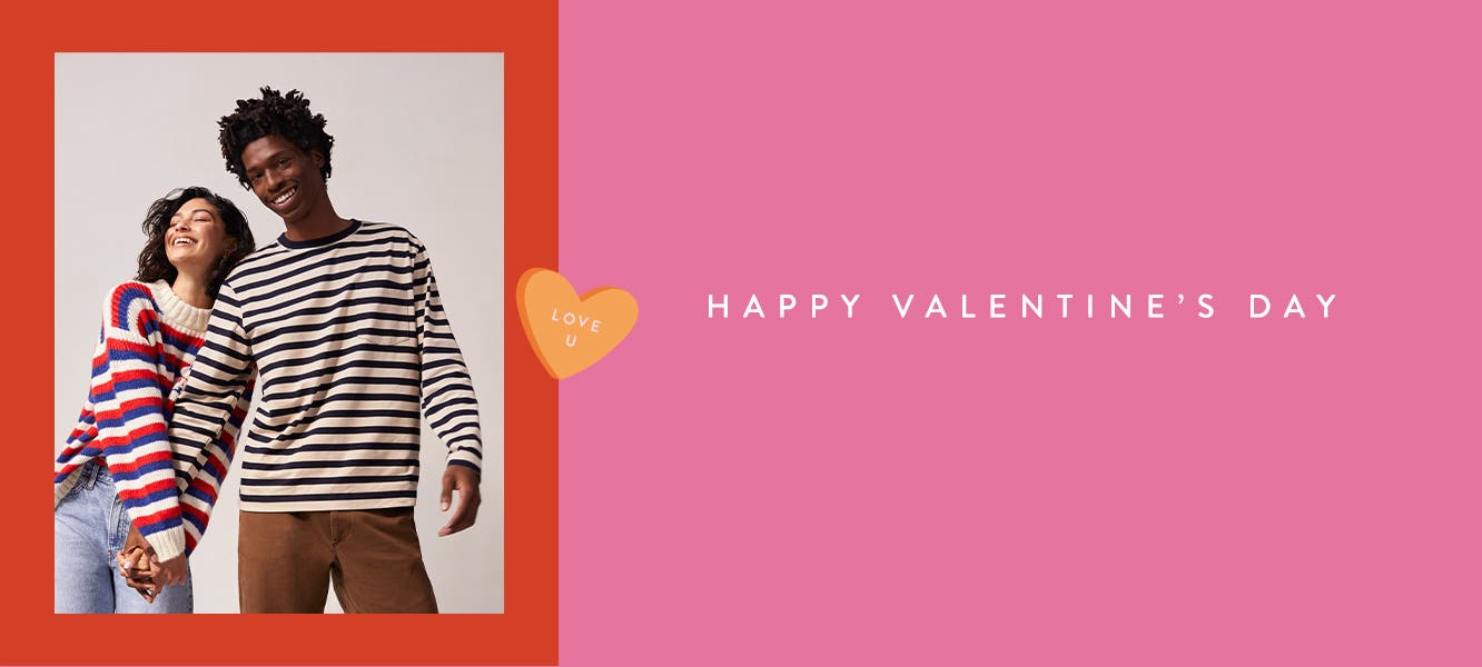 Happy Valentine's Day: a couple holding hands and wearing striped long-sleeve shirts.