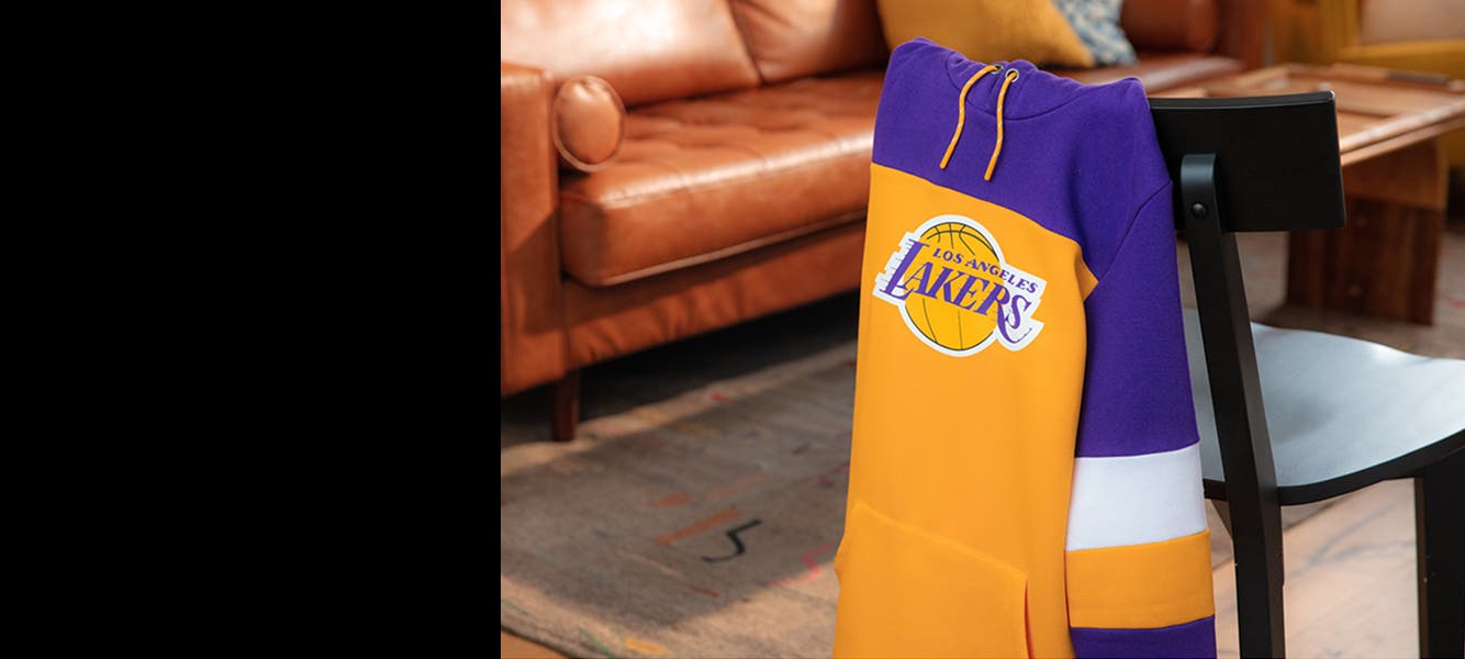 Gear up for game day: a sweatshirt featuring logo of the Los Angeles Lakers.