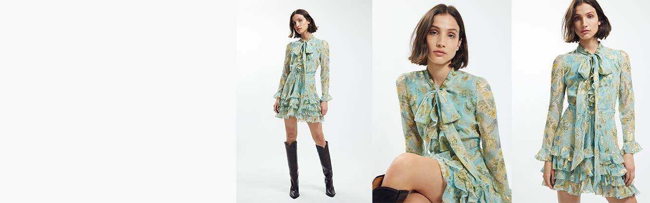 Model wearing designer dress.