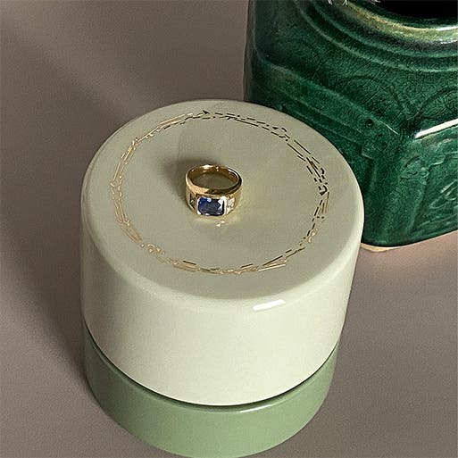 A gold ring with a gemstone.