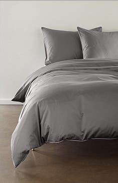 A grey sateen duvet cover and pillows.