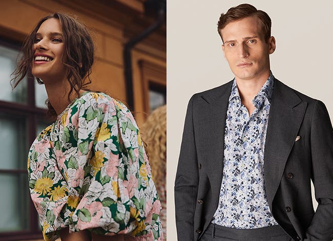 Woman wearing a floral dress. Man wearing a floral shirt and charcoal blazer.
