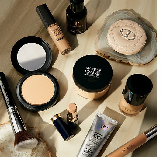 An assortment of face makeup products sitting on a countertop.