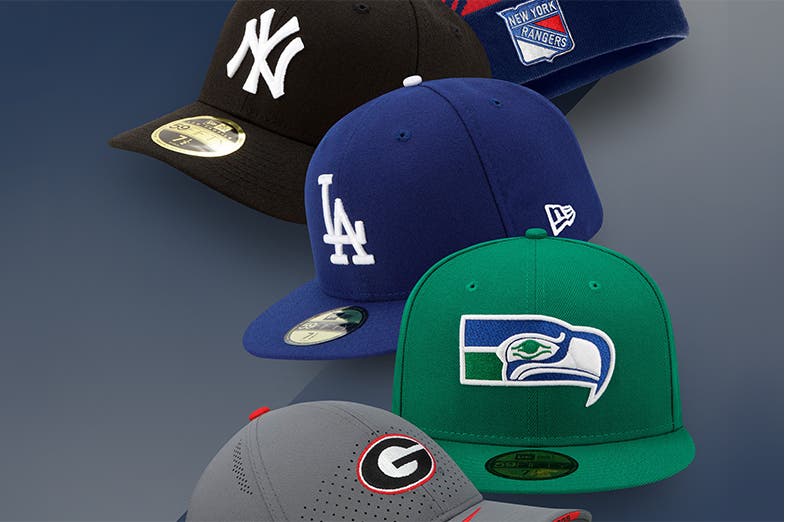 Logo hats from a variety of sports teams.