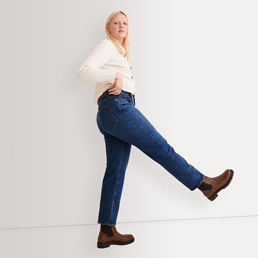 A woman wearing mom jeans.