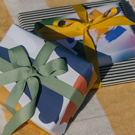 Two Father's Day gift boxes wrapped with a bow.