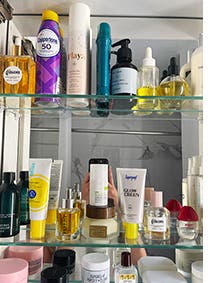 A medicine cabinet filled with beauty products.