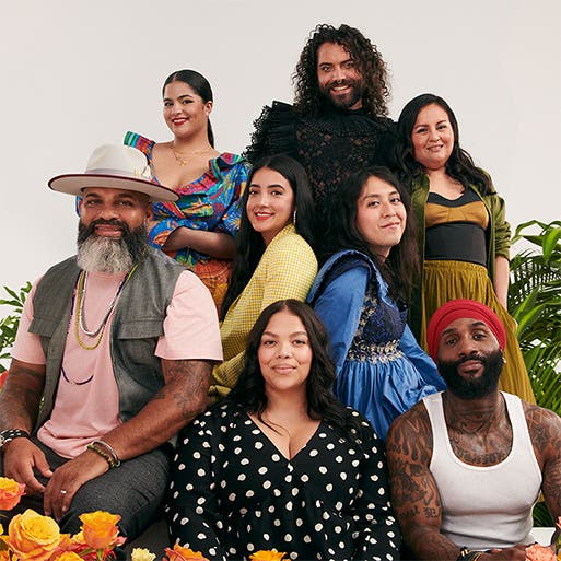 Hispanic and Latinx Nordstrom employees against a vibrant backdrop of greenery and flowers.