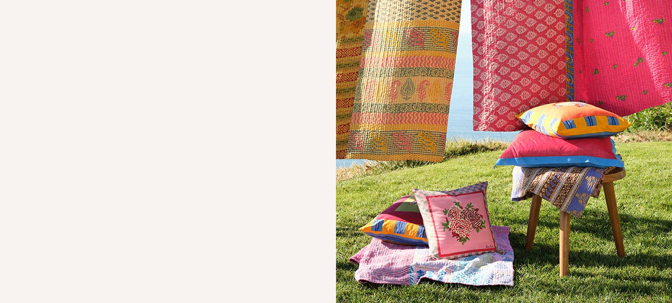 Colorful quilts and pillows.
