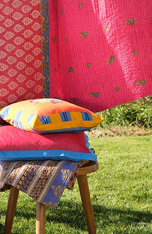Brighter days ahead: colorful quilts and pillows.