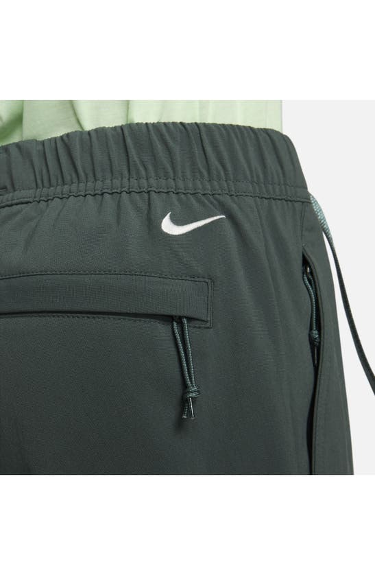 Shop Nike Acg Uv Trail Pants In Vintage Green/ Summit White