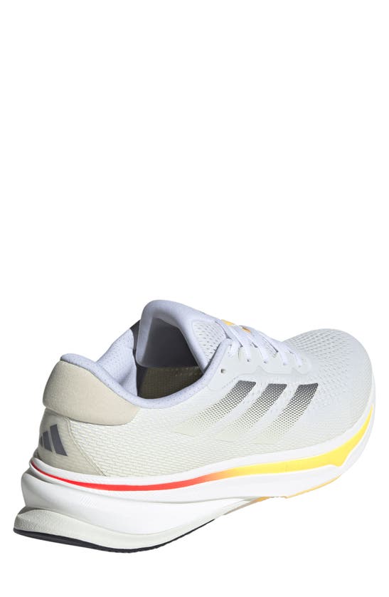 Shop Adidas Originals Supernova Rise Running Shoe In White/ Iron Metallic/ Spark