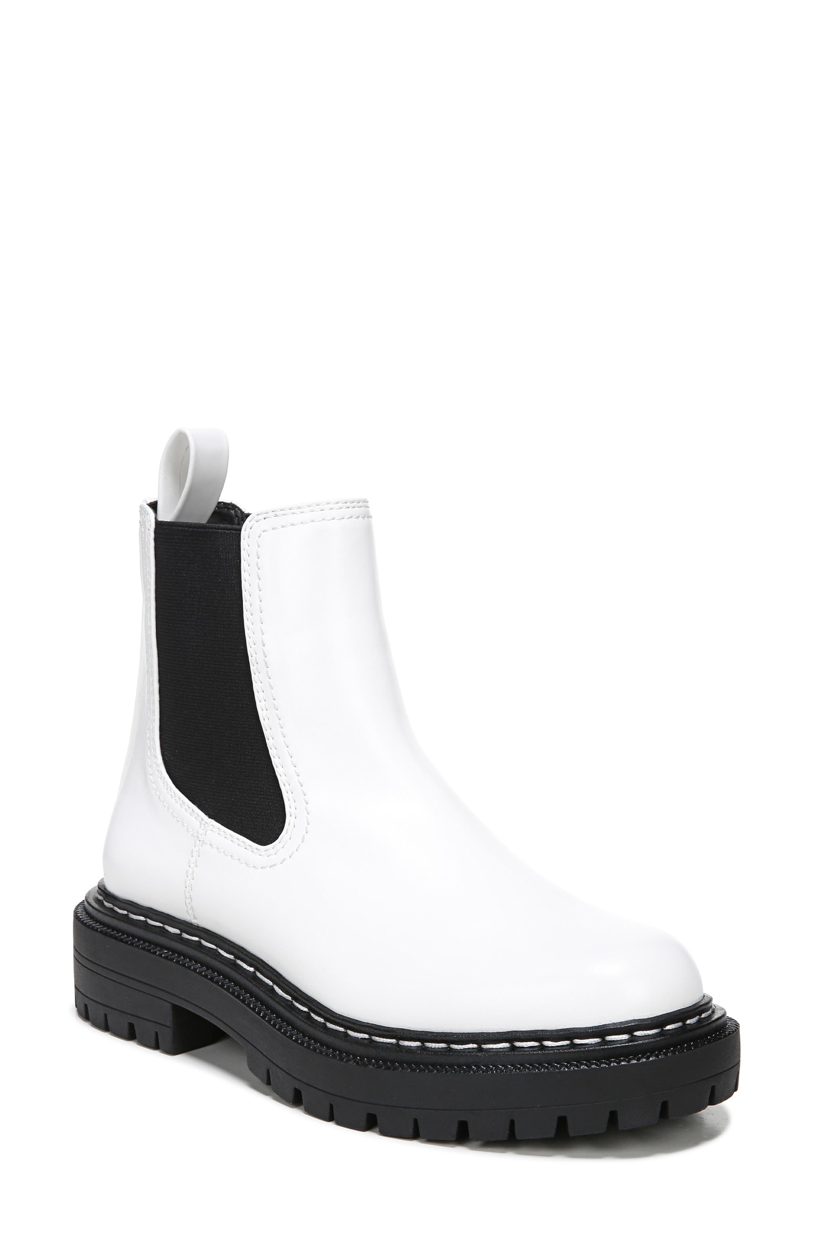 white boots with black bottoms