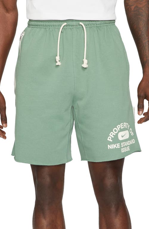 NIKE Dri-FIT Standard Issue Basketball Shorts in Dutch Green/Pale Ivory
