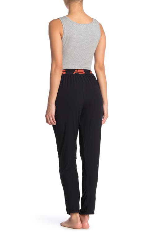 Shop Aqs Soft Knit Lounge Pants In Black W/orange