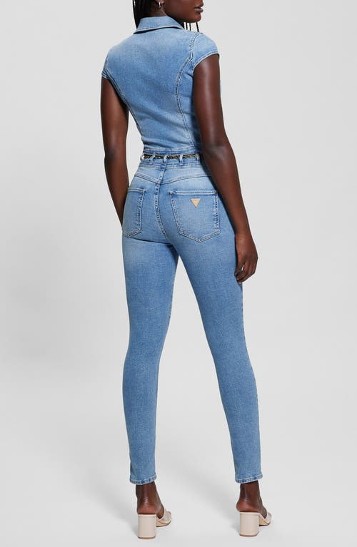 Shop Guess Nova Belted Button Front Denim Jumpsuit In Freebird