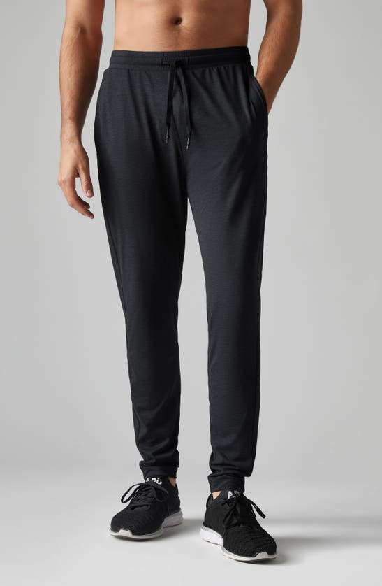 Shop Rhone Ooo Tapered Knit Pants In Black