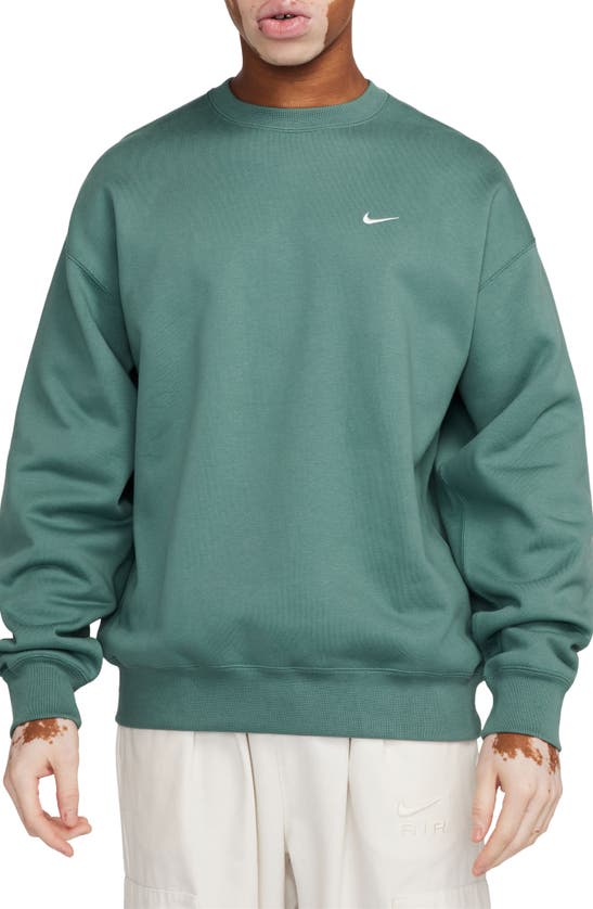 Shop Nike Solo Swoosh Oversize Crewneck Sweatshirt In Bicoastal/white