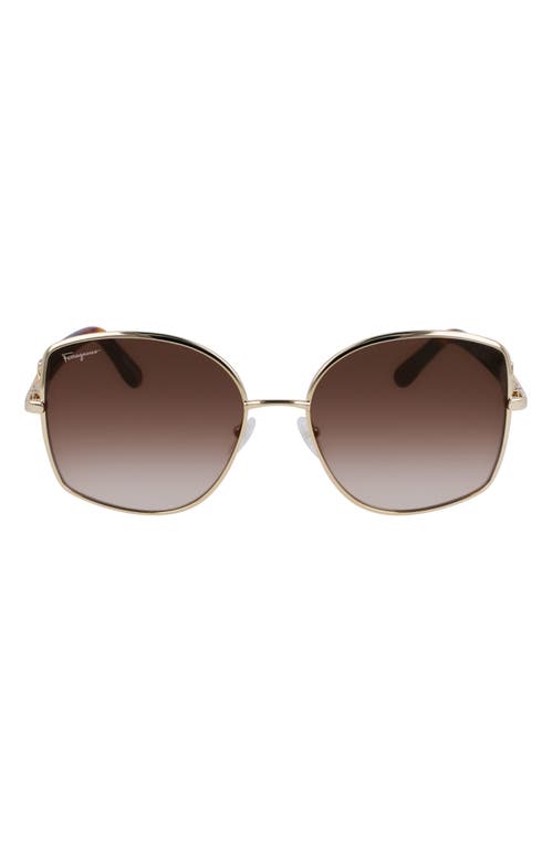 Shop Ferragamo Gancini 57mm Gradient Oval Sunglasses In Gold/brown Gradient