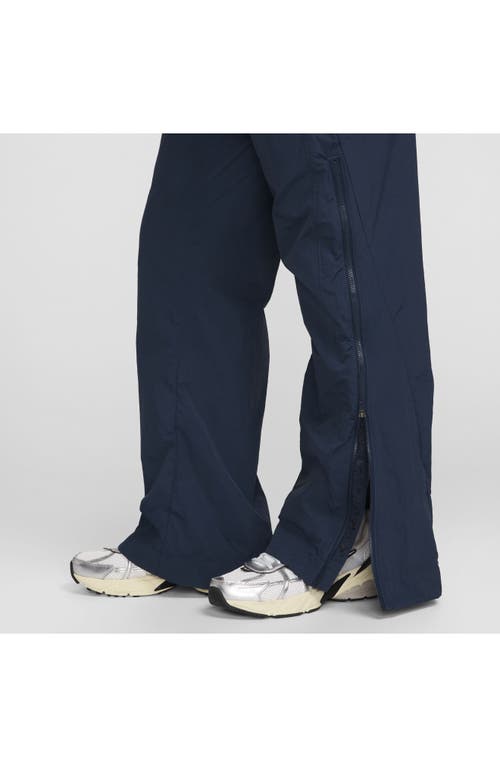 Shop Nike Sportswear Repel Zip Hem Pants In Armory Navy/black