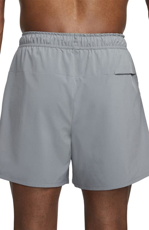 Shop Nike Dri-fit Unlimited 5-inch Athletic Shorts In Smoke Grey/black/smoke Grey