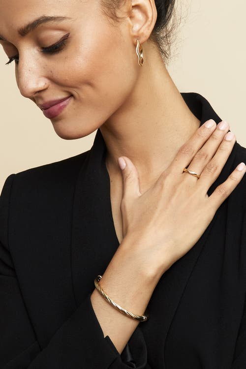 Oradina 14k Gold With A Twist Bangle Bracelet In Yellow Gold