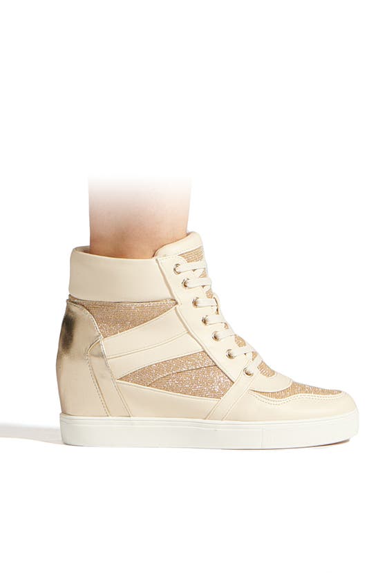 Shop Bcbgeneration Jansy Wedge Sneaker In Bianca-platino