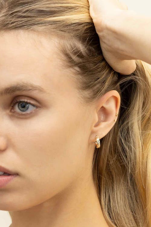 Oradina 14k Yellow Gold With A Twist Mini Hoops In Yellow Gold
