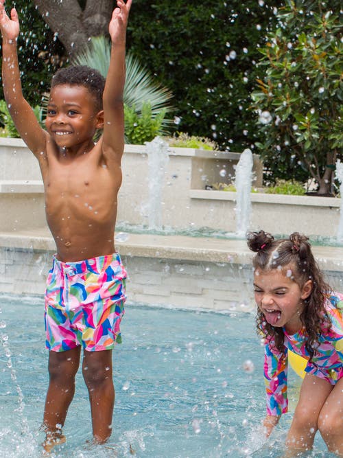 Shop Ruggedbutts Baby Boys Upf50+ Swim Trunks In Tropical Adventure