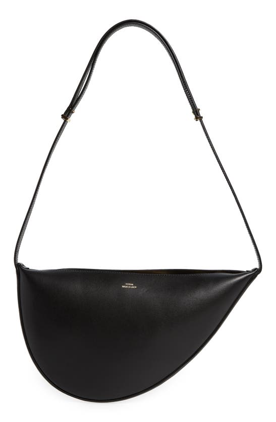 Shop Totême Scoop Leather Sling Bag In Black