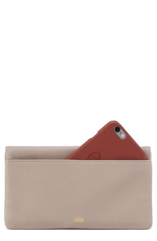 Shop Hobo Lumen Leather Bifold Wallet In Taupe