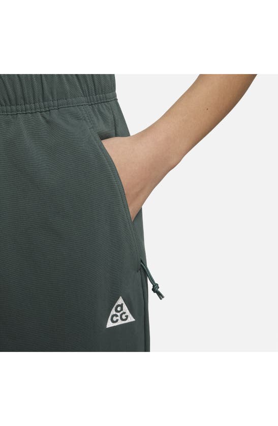 Shop Nike Acg Uv Trail Pants In Vintage Green/ Summit White