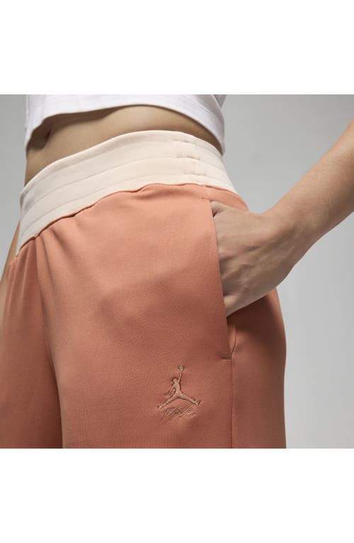 Shop Jordan (her)itage Snap Track Pants In Sky Orange/guava Ice